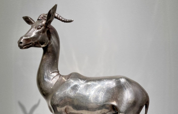 Alt text: Silvered bronze sculpture of a gazelle
