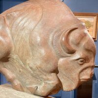 Alt text: Bronze sculpture of a bison