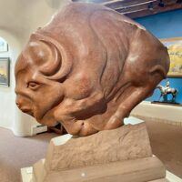 Alt text: Bronze sculpture of a bison