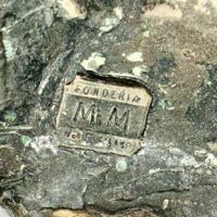Alt text: Bronze sculpture, foundry mark and signature stamp detail