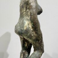 Alt text: Bronze sculpture of an Etruscan style nude female figure