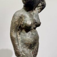 Alt text: Bronze sculpture of an Etruscan style nude female figure