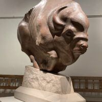 Alt text: Bronze sculpture of a bison