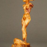 Alt text: Plaster sculpture of a woman on a shell