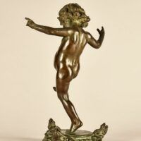 Alt text: Bronze sculpture of a skipping toddler