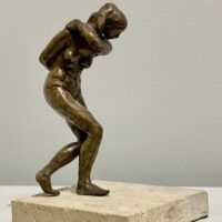 Alt text: Bronze sculpture of a dancing figure