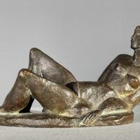 Alt text: Bronze sculpture of a reclining nude