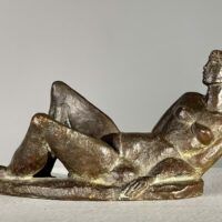 Alt text: Bronze sculpture of a reclining nude