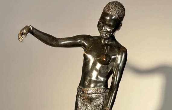 Alt text: Bronze sculpture of an African dancer