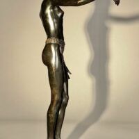 Alt text: Bronze sculpture of an African dancer