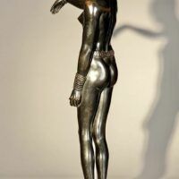 Alt text: Bronze sculpture of an African dancer