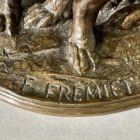 Alt text: Bronze sculpture, signature detail