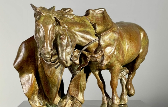 Alt text: Bronze sculpture of two horses