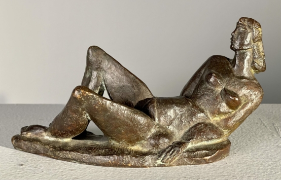 Alt text: Bronze sculpture of a reclining nude