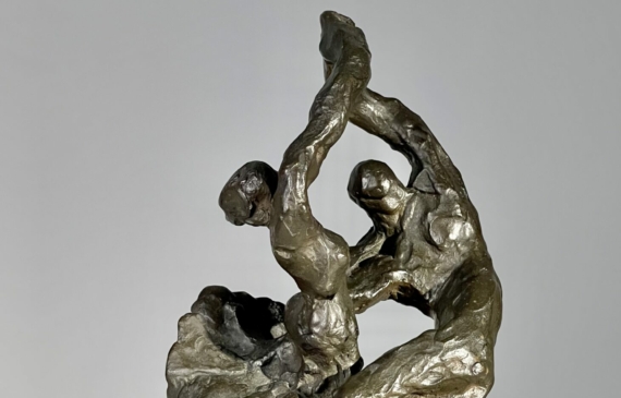 Alt text: Bronze sculpture of a dancing couple