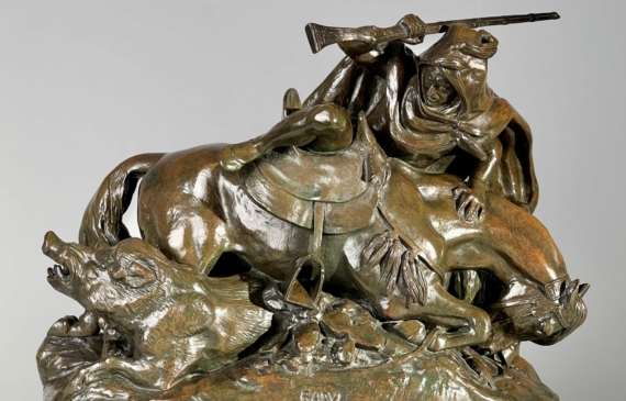 Alt text: Bronze sculpture of a Horseman Hunting Boars