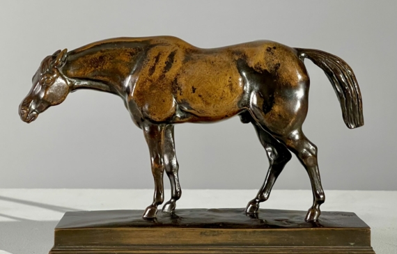 Alt text: bronze sculpture of a half blood horse