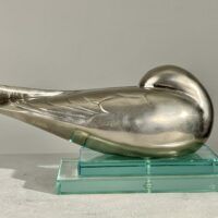 Alt text: metal sculpture of a sleeping bird