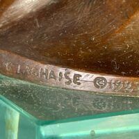 Alt text: Bronze sculpture, signature detail