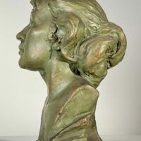 Alt text: Sculpture of a woman's face