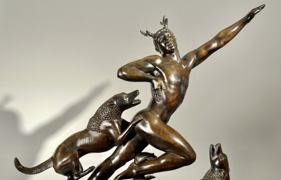 Alt text: Bronze sculpture of Actaeon with dogs