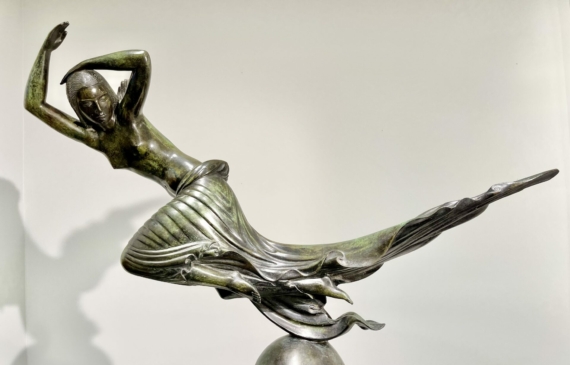 Alt text: Bronze sculpture of a floating woman