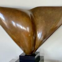 Alt text: Abstract bronze sculpture