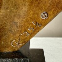 Alt text: Bronze sculpture, signature detail