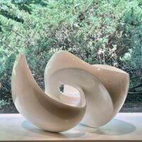 Alt text: glossy, oval shaped sculpture