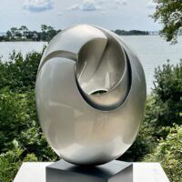 Alt text: glossy, oval shaped sculpture