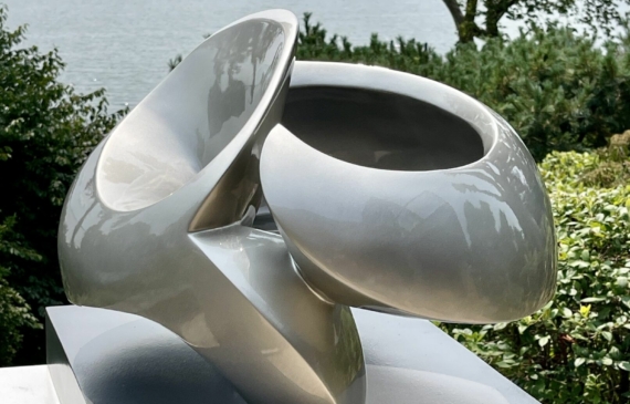 Alt text: glossy, oval shaped sculpture