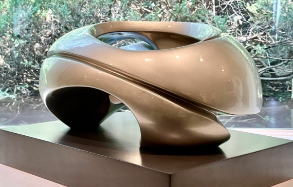 Alt text: glossy, oval shaped sculpture