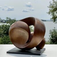 Alt text: bronze, oval shaped sculpture