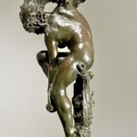 Alt text: Bronze sculpture of a woman looking down