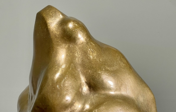 Alt text: Bronze sculpture of a frog