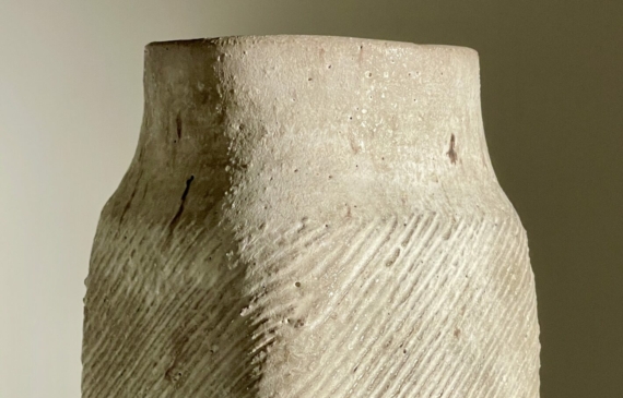 Alt text: White stoneware vase