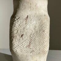 Alt text: White stoneware vase