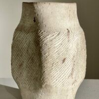 Alt text: White stoneware vase