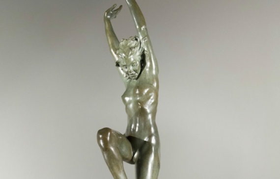 Alt text: Bronze sculpture of a standing woman