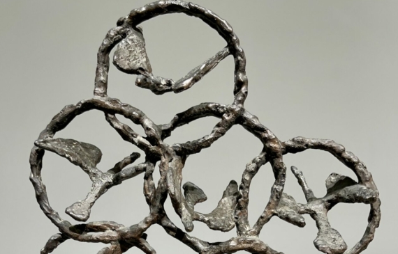 Alt text: Bronze sculpture of birds in circles