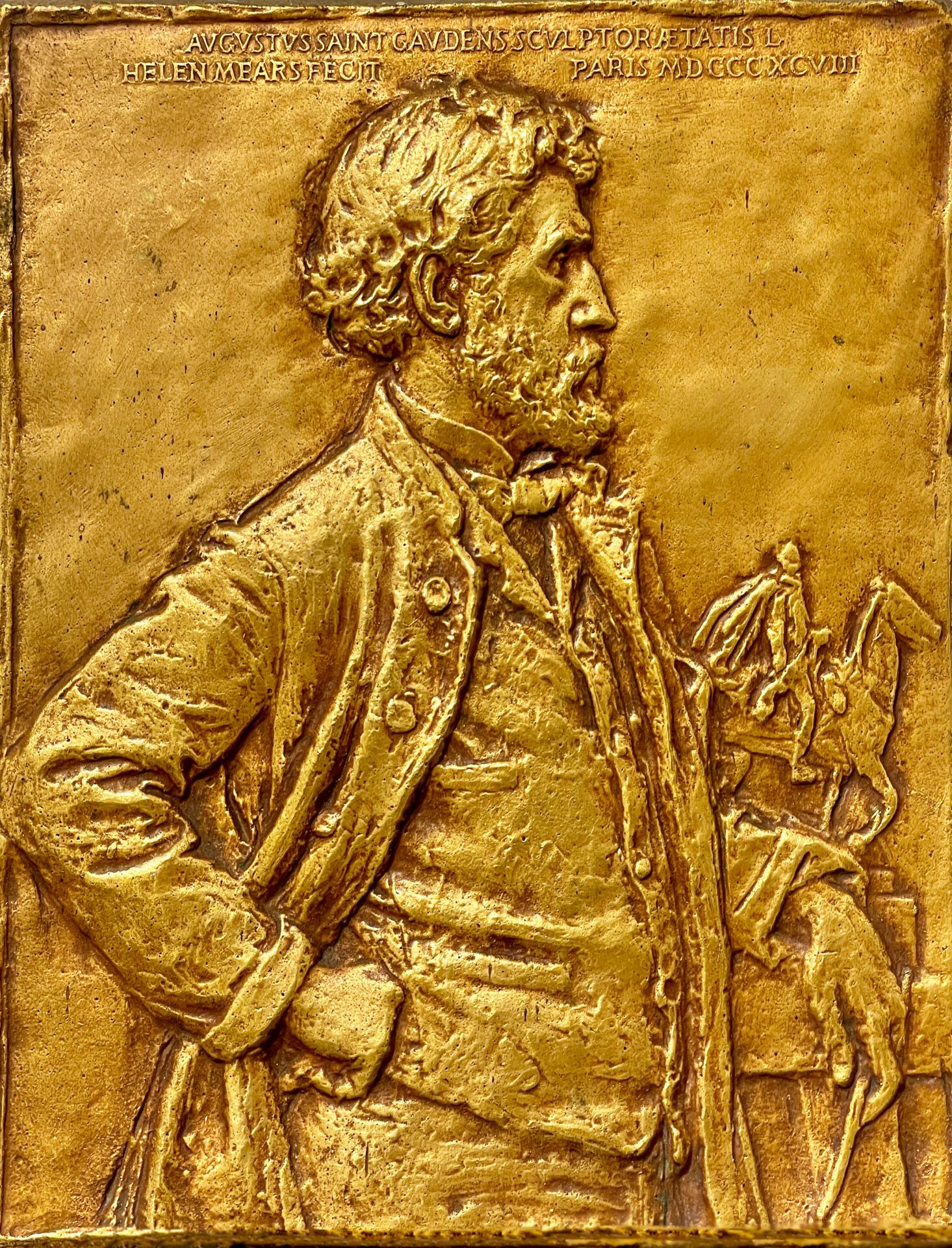 Alt text: Bronze relief of a gentleman