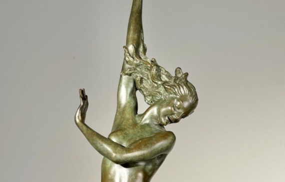 Alt text: Bronze sculpture of a standing woman