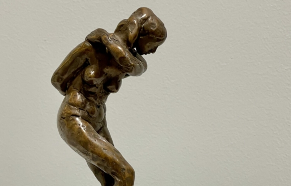 Alt text: Bronze sculpture of a dancing figure