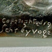 Alt text: Bronze sculpture, signature detail