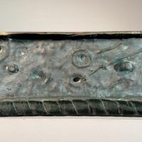 Alt text: Bronze sculpture, underside
