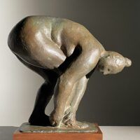 Alt text: Bronze sculpture of a nude woman bending over