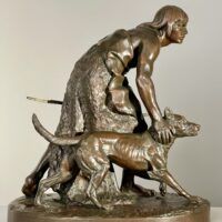 Alt text: Bronze sculpture of a figure with a dog