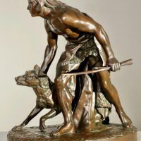 Alt text: Bronze sculpture of a figure with a dog