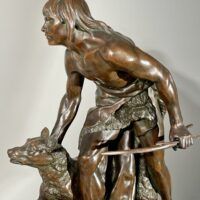 Alt text: Bronze sculpture of a figure with a dog