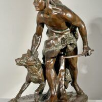 Alt text: Bronze sculpture of a figure with a dog